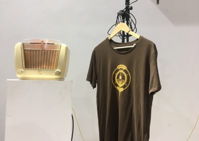 Ochre ink logo on Bakelite Brown T-shirt